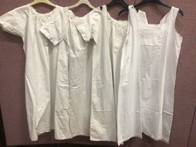 Lot 2085 - Victorian/Edwardian ladies' night dresses and a printed lawn apron with with lace inserts.