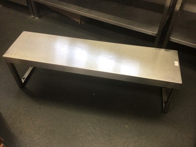 Lot 35 - A stainless steel shelf, on twin pedestals, 1160 mm