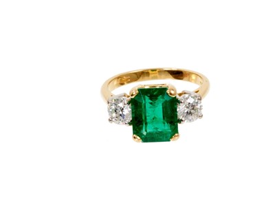 Lot 629 - A fine emerald and diamond three stone ring