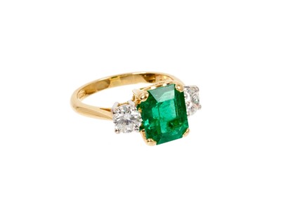 Lot 629 - A fine emerald and diamond three stone ring