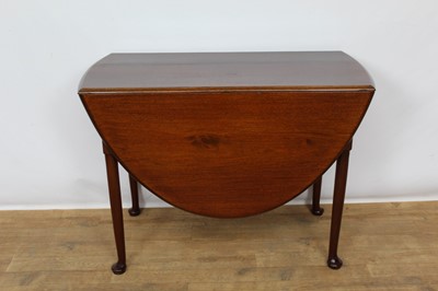 Lot 1418 - George II style mahogany drop leaf dining table, the oval hinged top on turned legs and pad feet, 150 x 107cm