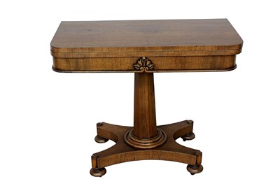 Lot 1420 - Regency mahogany card table, the rounded rectangular fold over top with green inset baize and well below, on flared facetted column and shaped base on bun feet and castors, 91cm wide x 45cm deep x...