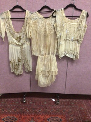 Lot 2092 - 1920's sheer beaded tunic, similar tunic with cord work and lace inserts , red beaded flapper dress and a beaded top (all in need of attention)