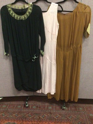 Lot 2093 - 1920's black silk crepe dress with dropped waist and lace trimmed neckline and cuffs plus a pink cotton day dress and a sheer brown dress .