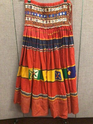 Lot 2102 - Vintage Banjari skirt with mirror - work, metal and glass beads and applique flowers.  Linen with printed cotton