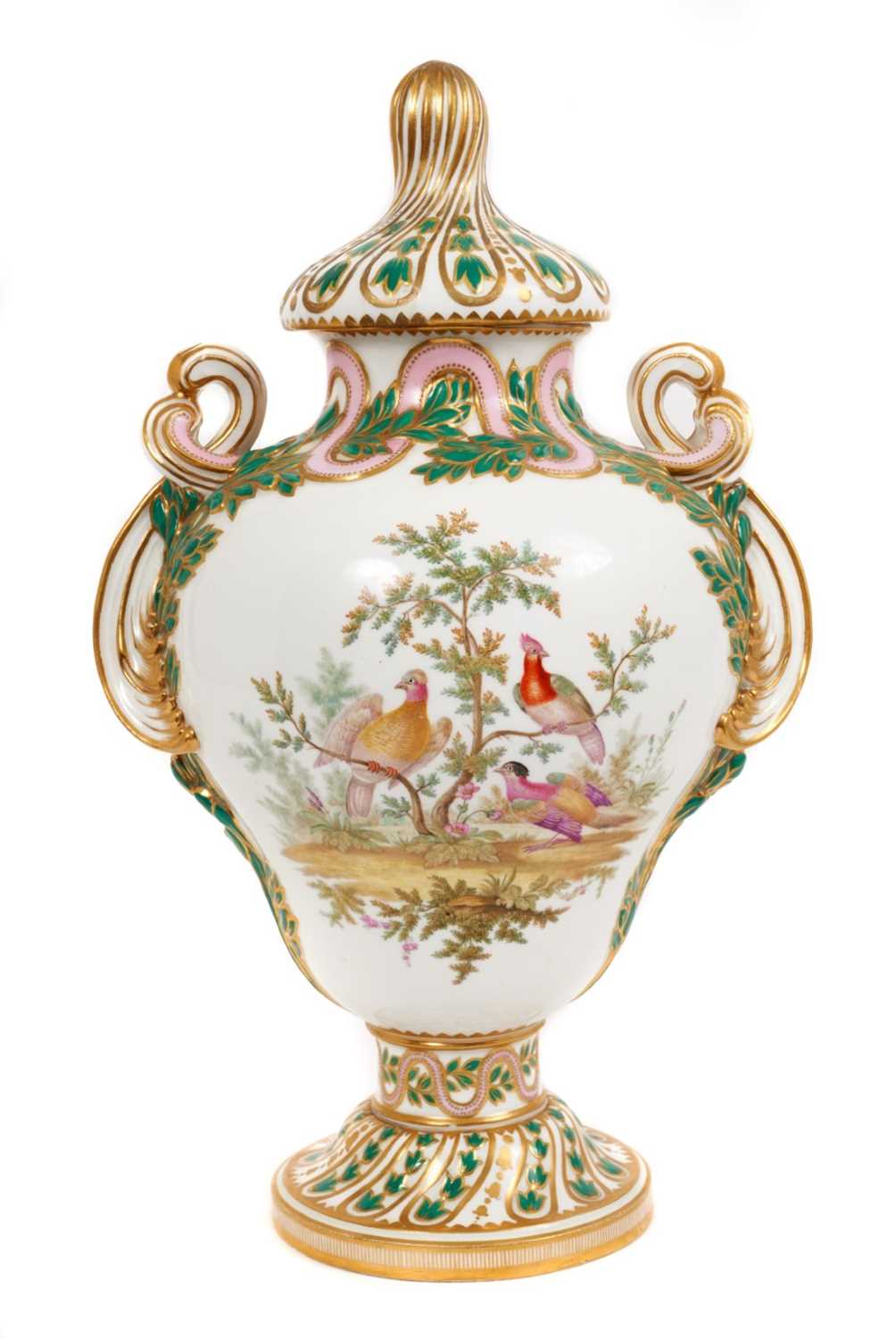 Lot 291 - A Minton Sevres-style vase and cover, circa 1850-70, polychrome decorated with flowers and exotic birds, on a green and pink ground with scrollwork handles, ermine mark to base, 32cm high