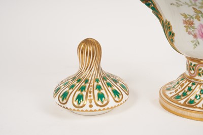 Lot 291 - A Minton Sevres-style vase and cover, circa 1850-70, polychrome decorated with flowers and exotic birds, on a green and pink ground with scrollwork handles, ermine mark to base, 32cm high
