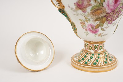 Lot 291 - A Minton Sevres-style vase and cover, circa 1850-70, polychrome decorated with flowers and exotic birds, on a green and pink ground with scrollwork handles, ermine mark to base, 32cm high
