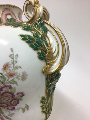 Lot 291 - A Minton Sevres-style vase and cover, circa 1850-70, polychrome decorated with flowers and exotic birds, on a green and pink ground with scrollwork handles, ermine mark to base, 32cm high