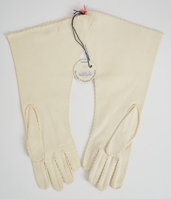 Lot 97 - Wallis Duchess of Windsor, pair very fine quality 1950s cream gauntlet gloves with very fine stitching and crimped borders, inventory label to interior and original Sotheby's part lot label for The...
