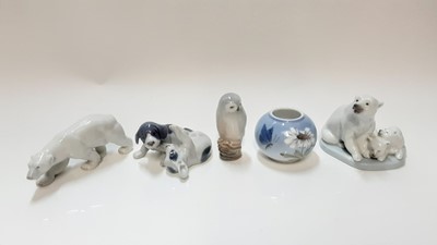 Lot 1256 - Four Royal Copenhagen figures "owl" "polar bear" "dogs playing" and small pot plus a Lladro polar bear group (5)