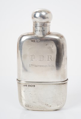Lot 514 - George V silver hip flask with removable cup gilded to interior, the body engraved 'P.D.R. 11th September 1923', (Sheffield 1920), maker Walker & Hall, all at 5.3ozs, 14.7cm in length.