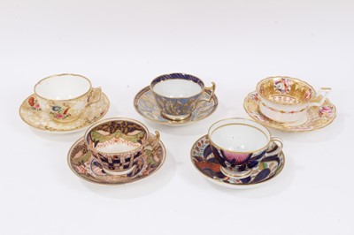 Lot 314 - Five early 19th century Coalport cups and saucers, various patterns, including floral painted and Imari style, some moulding