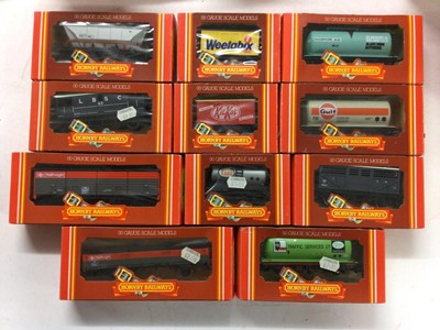 Lot 154 - Hornby OO Gauge rolling stock including Hopper (x14),Tank (x7), Coke (x3) Wagons plus animal, mineral, branded and Speedlink Vans and wagons, all boxed (34)