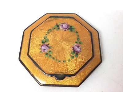 Lot 330 - Vintage orange guilloche enamel compact of octagonal form, 6cm in diameter.