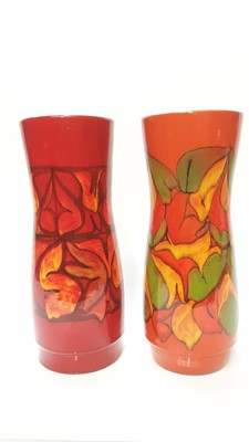 Lot 1158 - Two Poole Dephis vases with abstract decoration on orange, yellow and green ground, 31cm high