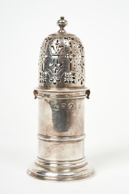 Lot 445 - Queen Anne silver sugar castor of cylindrical form, with pierced slip on cover with bayonet fitting, (London 1711), maker Charles Adam, 15.5cm in height, 5.7ozs.