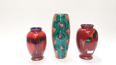 Lot 1159 - Three Poole pottery vases to include one with abstract decoration, signed N Massarella, 29.5cm high