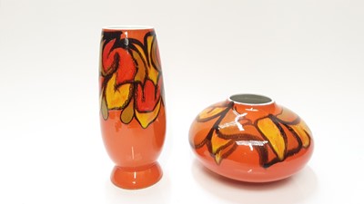 Lot 1162 - Two Poole Dephis vases with abstract decoration on orange, yellow and green ground, 22.5cm high and 12.5cm high