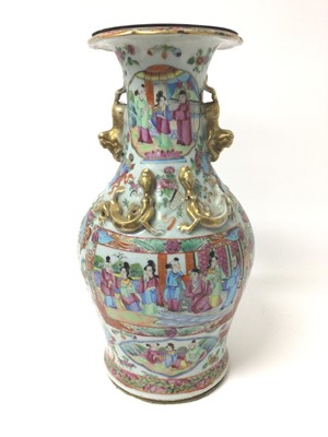 Lot 368 - 19th century Chinese Canton famille rose baluster vase, converted to a lamp, decorated with figural panels on a ground of precious objects, flowers and insects, with foo dog handles and moulded dra...