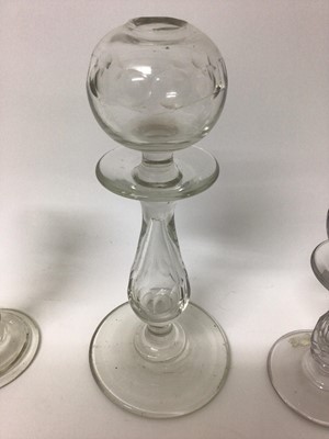 Lot 373 - Three 18th/19th century glass lacemaker's lamps, two with cut decoration