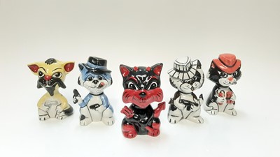 Lot 1181 - Five Lorna Bailey model cats - four with weapons, the other in the form of the devil