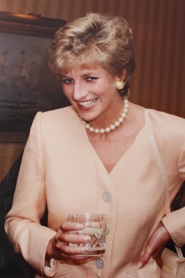 Lot 150 - Diana, Princess of Wales, five amusing informal photographs of Diana at a cocktail party