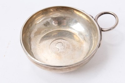 Lot 154 - A silver wine taster (marks rubbed) and two white metal wine tasters