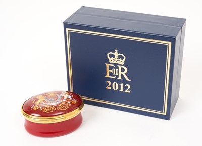 Lot 154 - H.M.Queen Elizabeth II 2012 Royal Household Christmas present, Halycon Days enamel Diamond Jubilee oval pill box decorated with the Royal Arms, 2012 and ' Presented by Her Majesty The Queen ' in or...