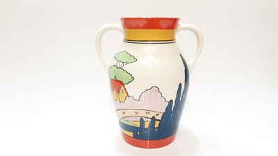Lot 1200 - Wedgwood limited edition two handled Lotus Jug decorated in the Orange Roof Cottage pattern, based upon an original by Clarice Cliff, no 13 of 250, 31cm high, boxed with certificate