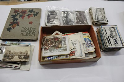 Lot 1418 - Postcards in album and loose. Good selection of real photographic cards including animated street scenes, busy Epsom racing showing the touts, horses and people, views of Pulham Market, Edwardstone...