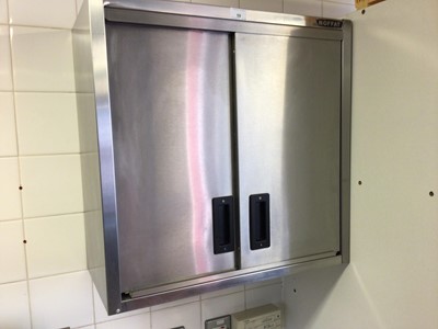 Lot 59 - A Moffat twin sliding door stainless steel wall cupboard, 600 mm together with two similar wall cabinets, each 900 mm