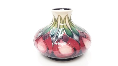 Lot 1225 - Moorcroft pottery squat vase decorated in the Tulip pattern, dated 2002, 11cm high, boxed
