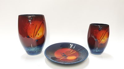 Lot 1271 - Two Poole pottery vases by Alan Clarke, 24cm high and 19cm high, together with a dish, 24cm diameter (3)