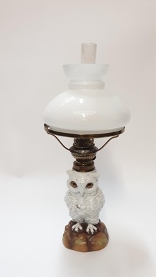 Lot 1282 - Late 19th century Dresden porcelain owl oil lamp with glass eyes and opaque glass shade