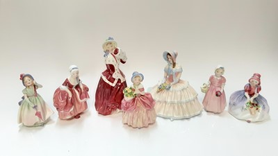 Lot 1277 - Seven Royal Doulton figures - Daydreams HN1731, Christmas Morn HN1992, Monica HN1467, Goody Two Shoes HN2037, Tinkle Bell HN1677 and Babie HN1679