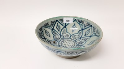 Lot 1284 - Old Izmic pottery bowl, 19th century blue and white transfer decorated ashet, two others and Continental pottery fruit bowl.
