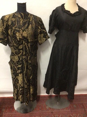 Lot 2113 - 1940's black evening dress with ruffled neckline and ruffled half moon applique to skirt and sleeves. Victorian black bodice, black and gold brocade dress, black dress by Dorothy Walker Model and 1...