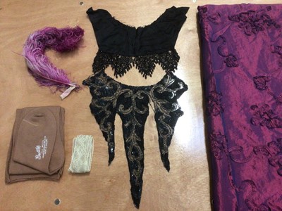 Lot 2116 - Victorian cream silk bodice, Art Nouveau beaded dress embellishment, pair of wool stockings, large piece of blue and pink ribbon work fabric and other items.
