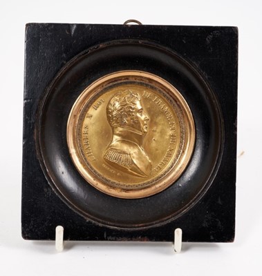 Lot 730 - 19th century gilt copper medallion depicting Charles X, in ebonised 
wood frame
