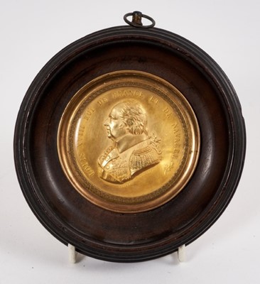 Lot 731 - 19th century gilt copper medallion depicting Louis XVIII, in ebonised 
wood frame