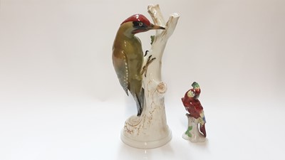 Lot 1294 - Good quality porcelain model of a green Woodpecker, by E Sode, together with another bird (2)