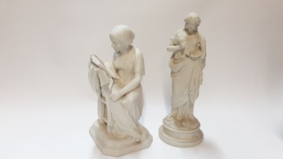 Lot 1314 - Parian figure of a seated lady reading a book, 32cm high, together of a lady with painting pallette, 34.5cm high
