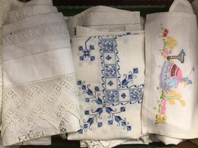 Lot 2119 - A lot of worked table linens including crochet edged table cloths, pulled thread and cut-out work, embroidered cloths etc. Plus six small vintage Christmas tree decorations.