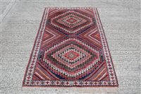 Lot 1204 - Iranian rug, having two serrated medallions...
