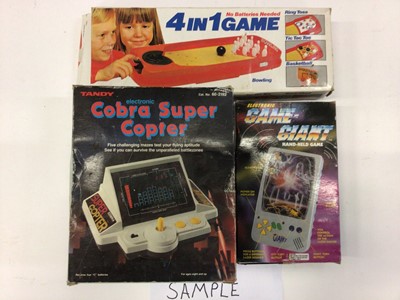Lot 1978 - Box of Retro hand held games together with Tandy electronic Cobra Super Copter game and Nintendo Snoopy Tennis