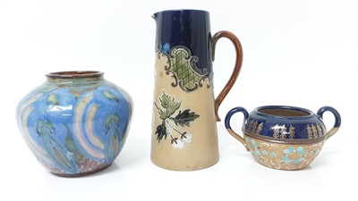 Lot 1345 - An unusual Doulton Lambeth vase decorated with flowers, and two further pieces of Doulton Lambeth pottery (3)