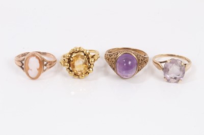 Lot 290 - 9ct gold citrine ring in gold ball setting, 9ct gold purple cabochon ring in engraved scroll setting, one other 9ct gold gem set ring and 9ct gold cameo ring