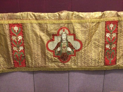Lot 2123 - Embroidered Altar cloth, central panel of appliqued painted silk with side panels of appliqued and embroidered flowers.