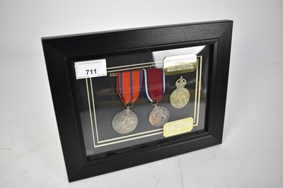 Lot 711 - Police medal pair comprising George V Coronation (Police) medal 1911 named to P.C. P. Evans and a silver Jubilee medal 1935 (unnamed as issued), mounted in glazed frame with an associated George VI...